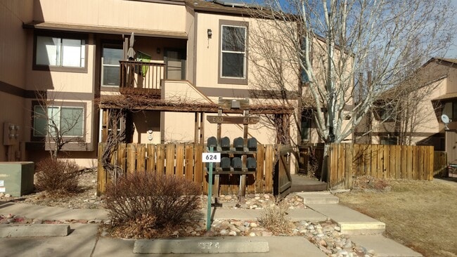 Open gate to garden patio, stairs to upper deck and front door. - 614 Tantra Dr