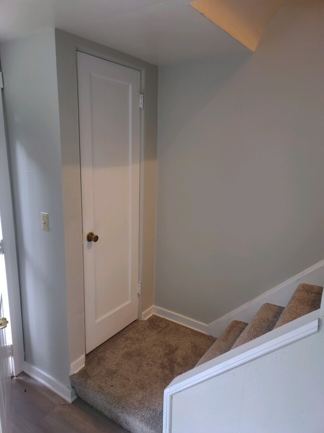 Coat Closet/Stairs - Jameson Townhomes