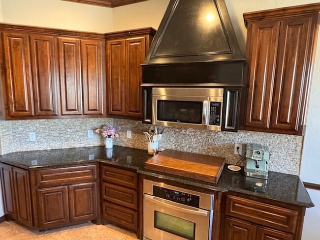 Photo - 3 bed plus office , 3 car garage with storm shelter, shop with electric and covered patio in Moor...