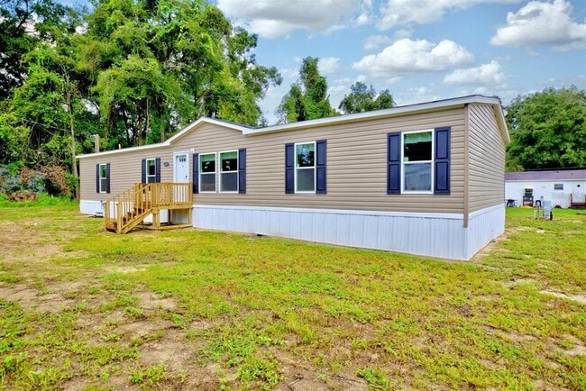 Building Photo - 8595 NW 13th Ct