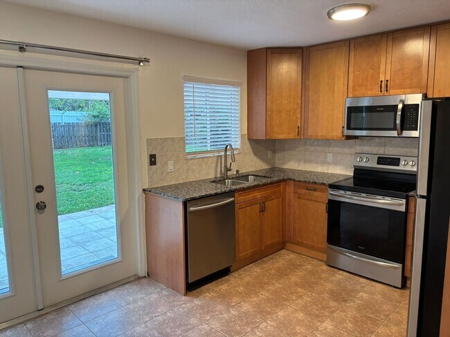 Photo - 2/2/1 home with a spacious fenced backyard...