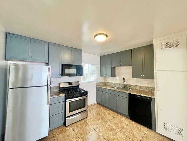 Photo - 2BD 1BA Apt Next to USD - Spacious Downstairs Unit, Pet Friendly, 1 Parking Space, No Carpet Unidad 5838