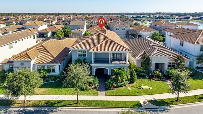 Building Photo - Luxury 5-Bedroom Residence in Eagle Creek with Indoor-Outdoor Living