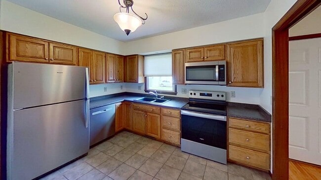 Photo - Updated two bedroom duplex, new stainless steel appliances, garage, and hardwood floors