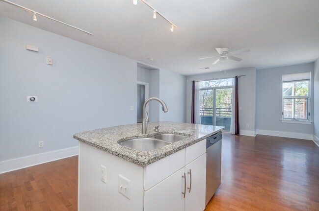 From the kitchen looking at the island and the living room and dining area - 1600 Fulton Ave Unit Fulton202