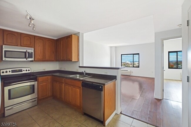 Building Photo - 1 Carriage City Plz Unit 1203