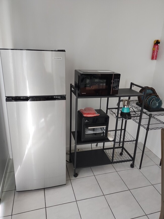 Brand new refrigerator with freezer/brand new air fryer oven/ brand new microwave oven - 6999 W 25th Ave Unit Studio/efficiency