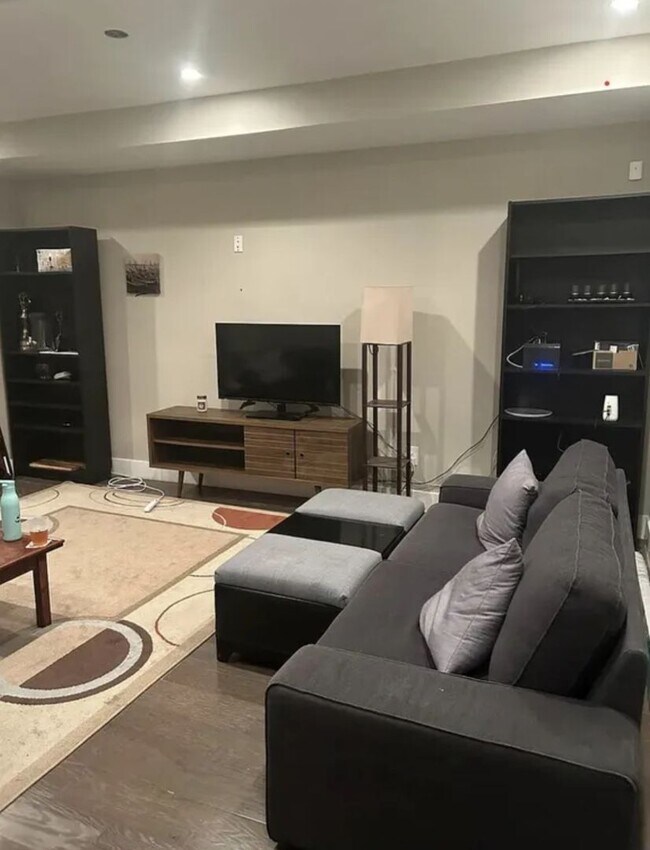 Photo - “Elegant 3-Story Home Showcasing High-End Renovation, Gourmet Kitchen, and Private Deck for Moder...