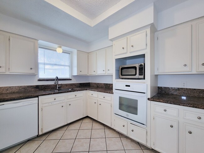 Photo - Come and view this open floor plan with much potential. Formal and dining room, granite counters,...