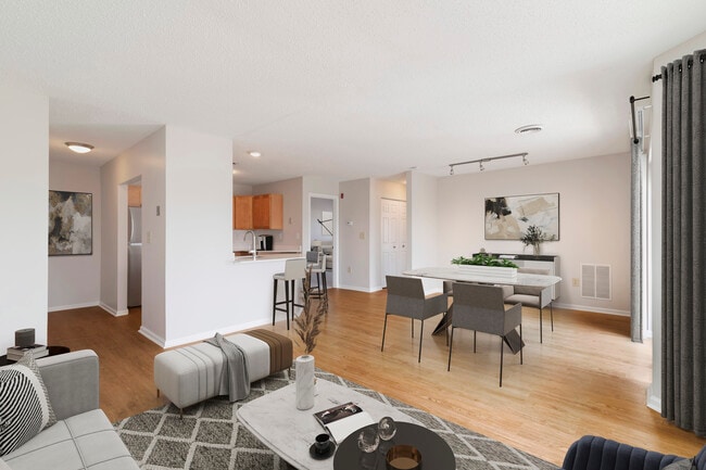 Renovated Package I living and dining room with hard surface flooring