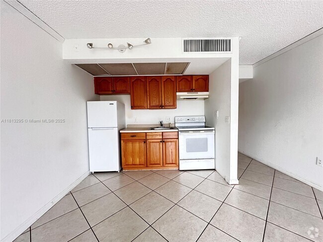 Building Photo - 13455 SW 16th Ct Unit 311F Rental