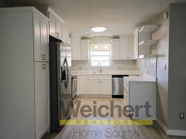 Photo - Updated 4-Bed Home with Fenced Yard & Carport