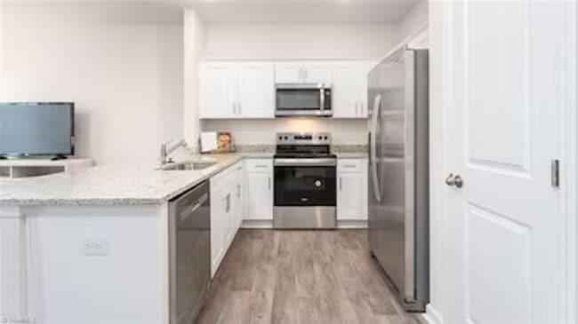 Photo - Modern 3-Bedroom Townhome with Garage in North Village Townes