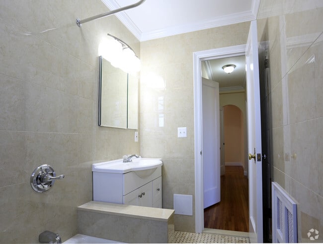 bathroom with tub and shower