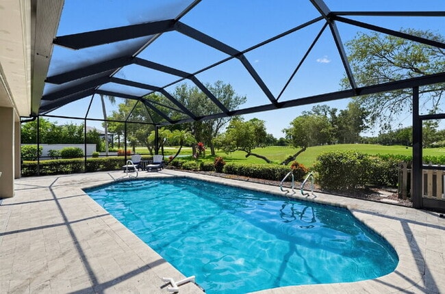 Photo - Turnkey furnished 4 bedroom, 3 bath pool home on the golf course in Boca Royale, with a full golf...