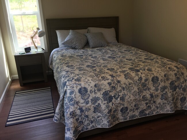 Bedroom with one queen bed.