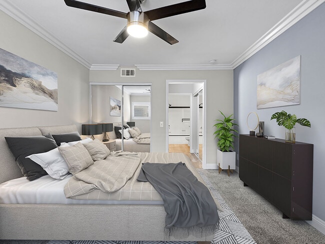 Large bedroom with ceiling fan.