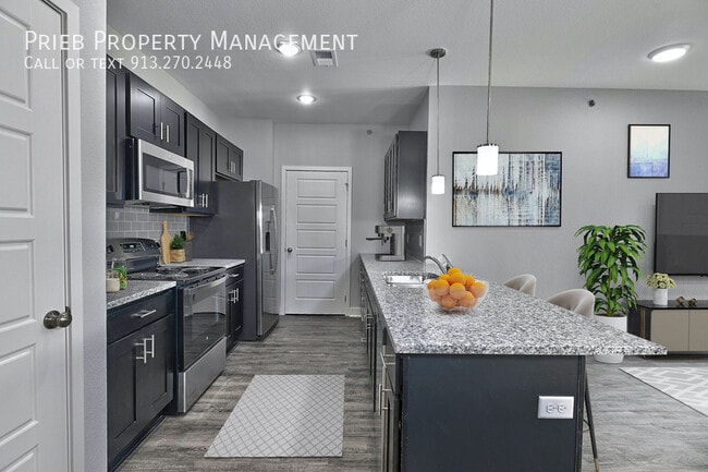 Building Photo - 22204 W 123rd Terrace Unit 309-B6