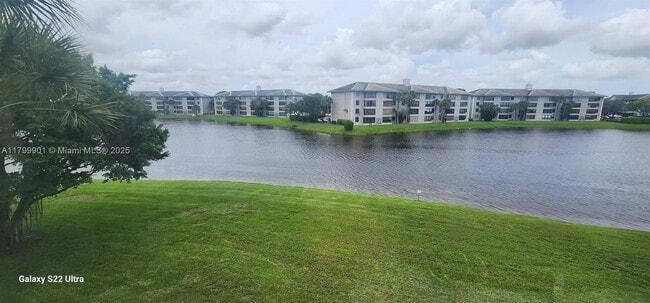 Building Photo - 9420 Poinciana Pl Unit 310