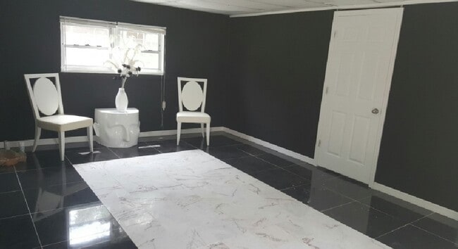 living room with custom marble tile - 399 Ave B Ave SE Unit 399. Ave B