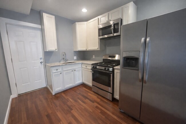 Photo - Two-Bedroom Rowhome with Modern Kitchen in Baltimore