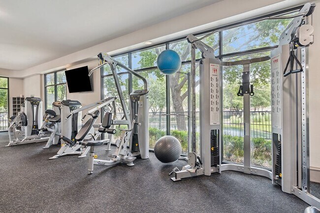 Fully-equipped fitness center with cardio and weight equipment