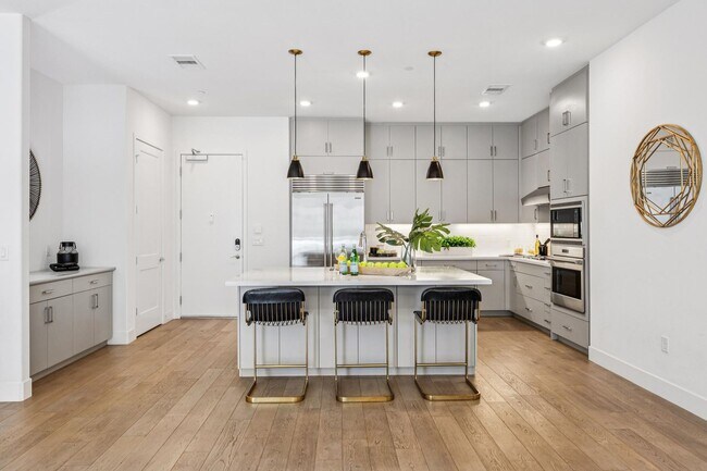 Photo - Luxury Single-Level Corner Residence with Wolf Kitchen & Private Garage Unit 208A