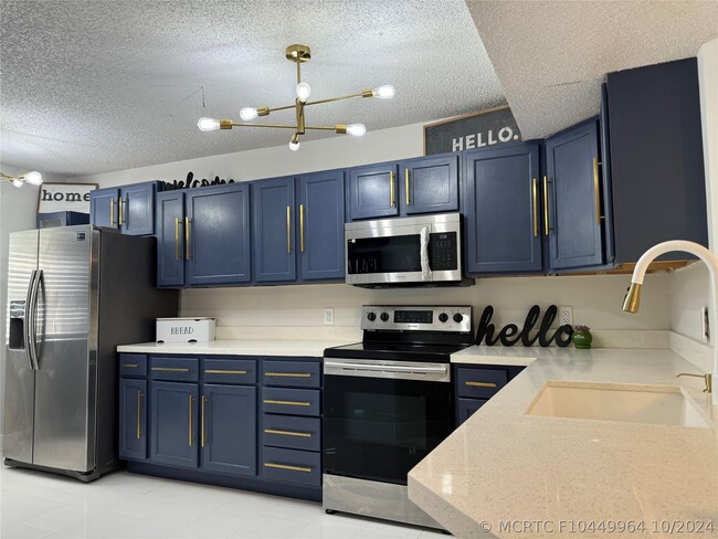 Building Photo - 8891 Wiles Rd Unit 208