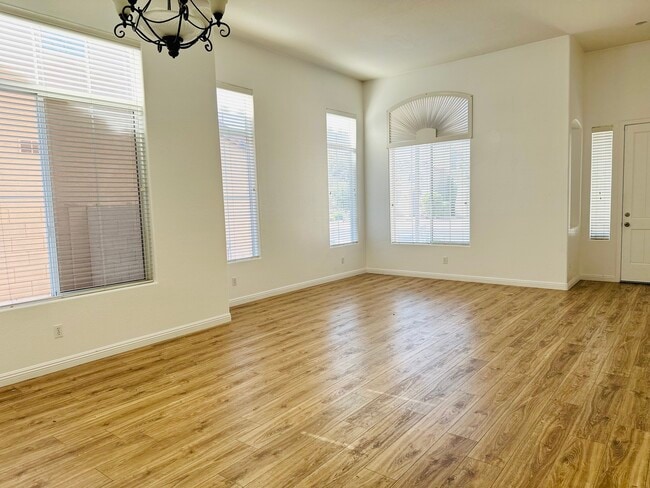 Bright formal living and dining area near the front entry.