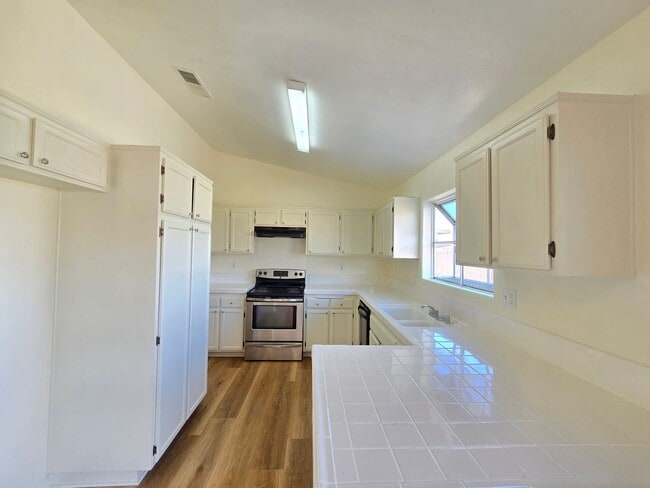 Photo - 4 bedroom / 2 bathroom / Open Floor Plan House/ New Vinyl Flooring throughout the house