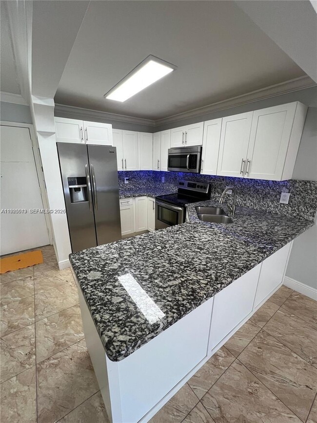 Photo - 1075 W 68th St Unit 218