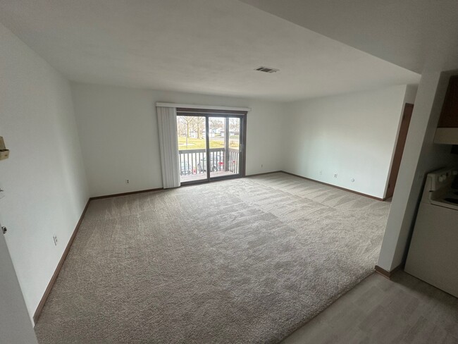 Living room & deck view from Kitchen - 2323-3030 31st Ave Apartments