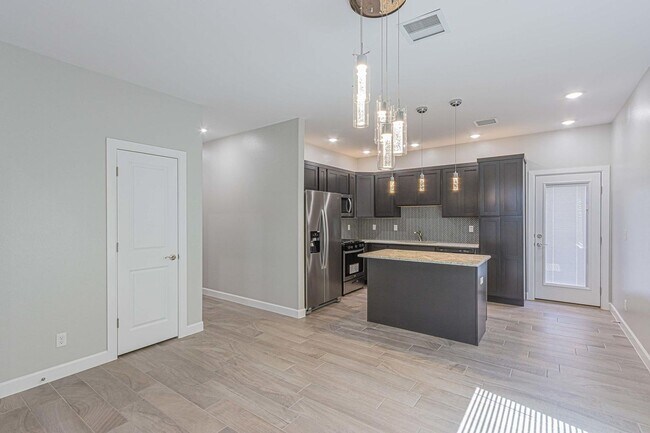 Photo - Modern open floor plan, perfect for comfortable living and entertaining.