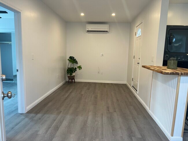 Brand new vinyl flooring throughout home. Living room houses the heater and AC - 9300 Benson Way Unit B