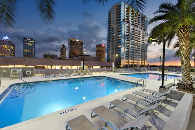 Pool deck with lounge chairs - Element Apartments