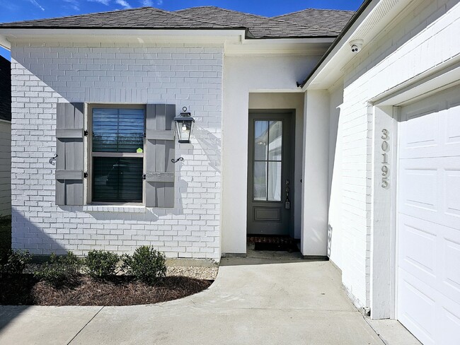 Photo - Stunning 4-Bedroom Waterfront Home with Granite Countertops and Hardwood Floors in The Sanctuary ...