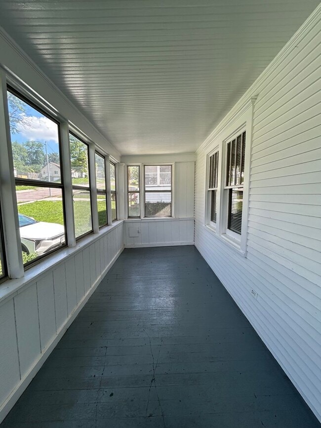 Photo - Charming 3-Bedroom Home with Finished Attic, Enclosed Front Porch & Spacious Backyard