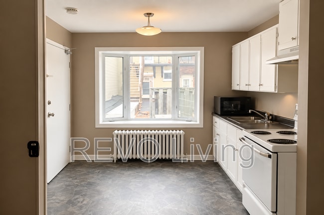 Building Photo - 73 St Paul St Unit Back