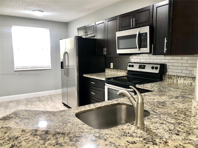 Photo - 8761 Wiles Rd Unit 306