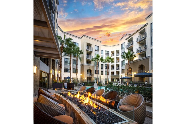 Poolside courtyard with fire pits and seating