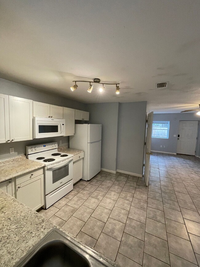 Photo - Open floor plan, four-bedroom two-bathroom with washer and dryer Unit 2
