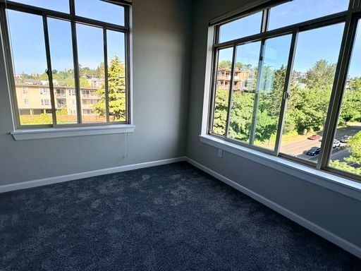 Photo - Top-Floor Corner 2BR with Lake Union Views + Garage Parking Included!