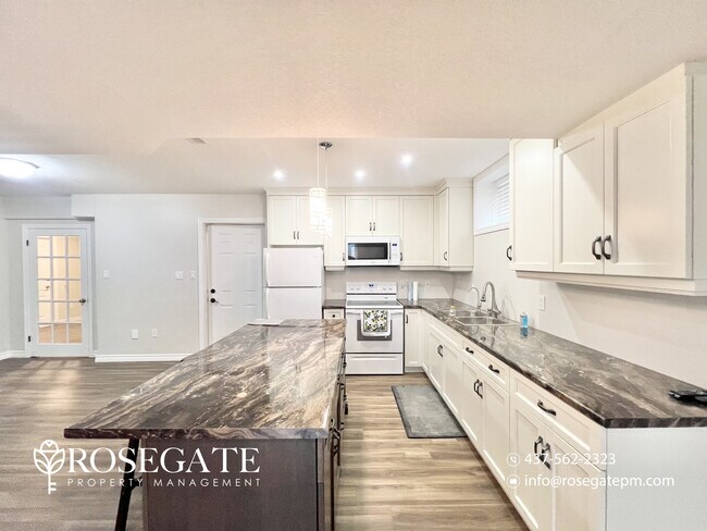 Photo - Stylish 2-Bedroom + Den Home with Backyard... Unit 2
