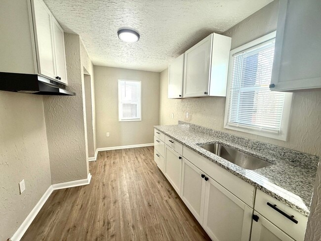 Photo - This beautifully updated 4-bedroom, 1-bath single-family home is ready for move-in!