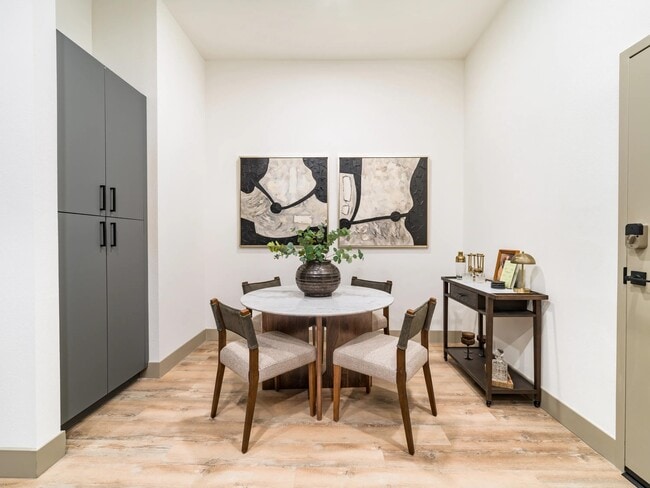 Dedicated dining areas provide a comfortable setting for meals, entertaining, or working from home, complemented by contemporary finishes and wood-style flooring.