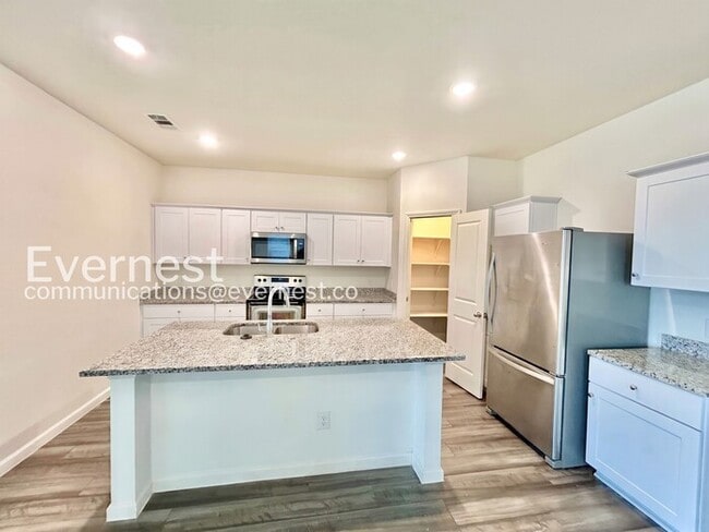 Photo - 5 Bed/3 Bath Home with Fenced Yard & Garage / Pet-Friendly / Available Now!