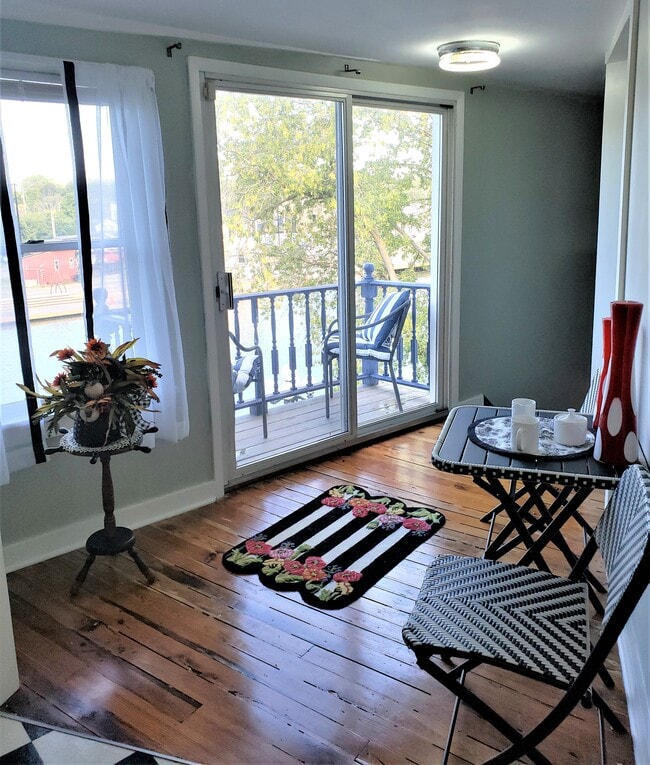 Hall coming into property with mini table for early morning coffee with a view - 20 Roselawn Ave Unit #2