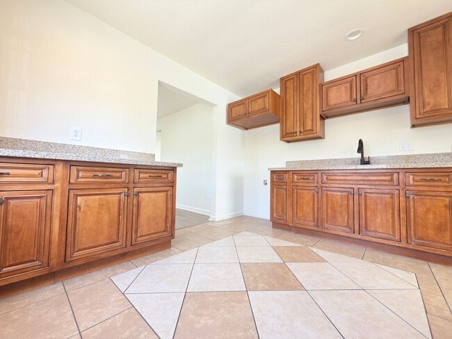 Photo - Spacious 4-Bedroom, 2-Bath Gated Home with Garage & Private Backyard