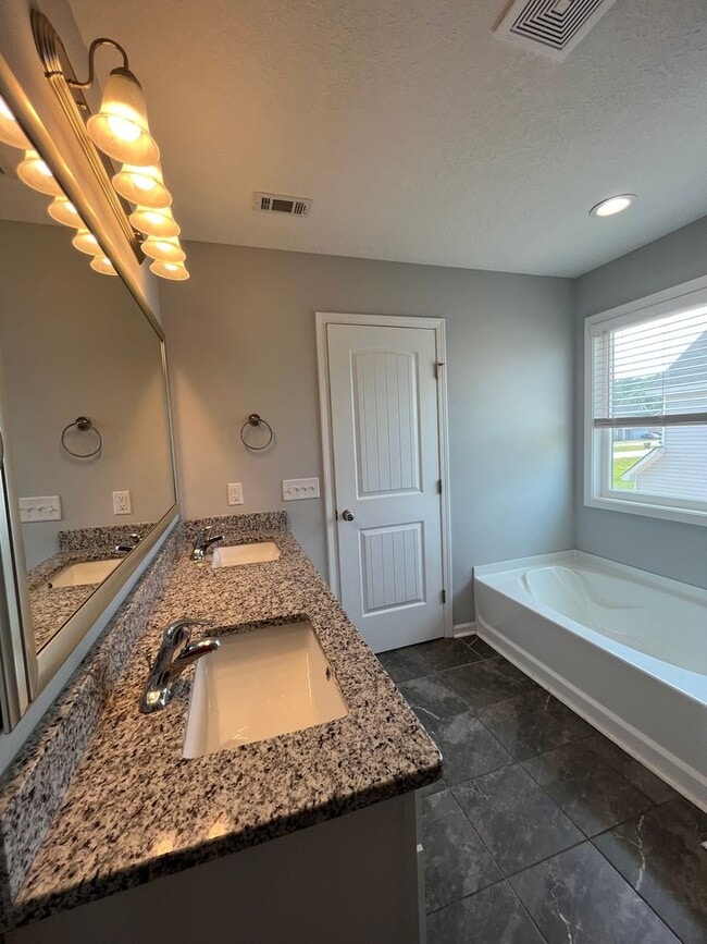 Photo - Spacious 4-Bedroom Pet Friendly Home with a Serene View - Available for Rent!