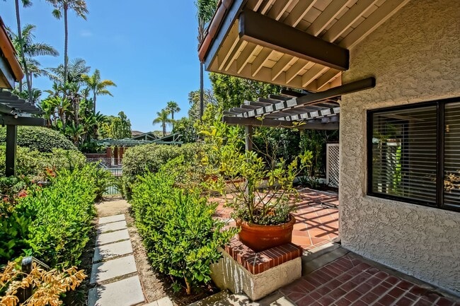 Photo - PRIME POOLFRONT LOCATION & CLOSE TO MAIN GATE! BRIGHT & SPACIOUS, END-UNIT POOLFRONT TOWNHOUSE W/...
